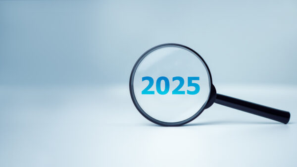 2025 vision concept with magnifying glass and calendar date for Jacksonville radio audience engagement.